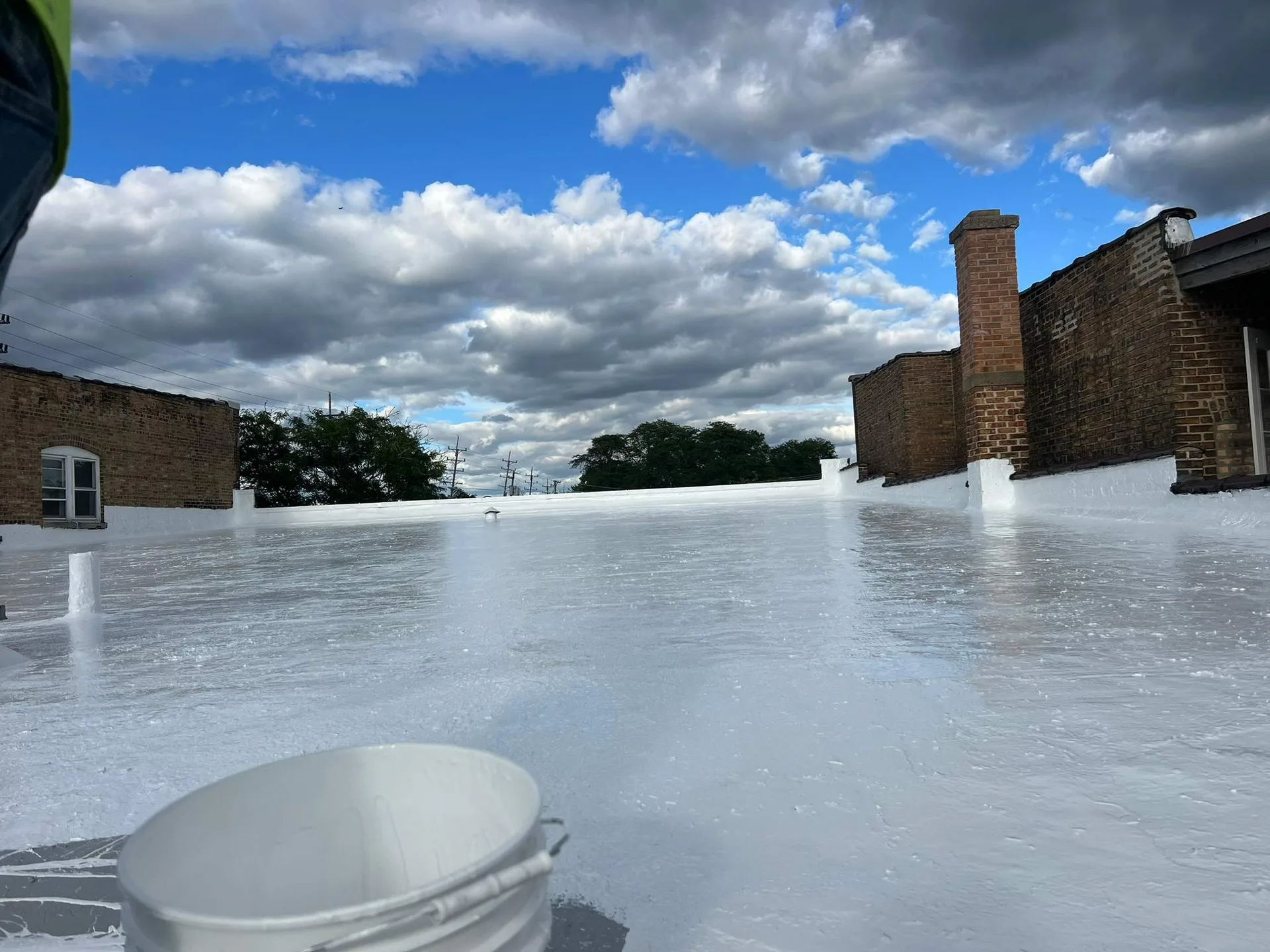 Completed commercial roof coating restoration by Americanstruction