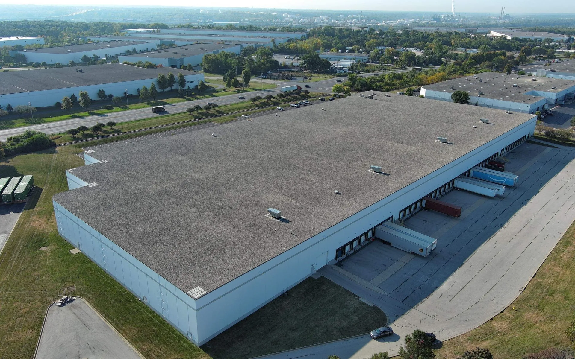 Aerial drone survey of an industrial flat roof enrolled in a preventative maintenance program
