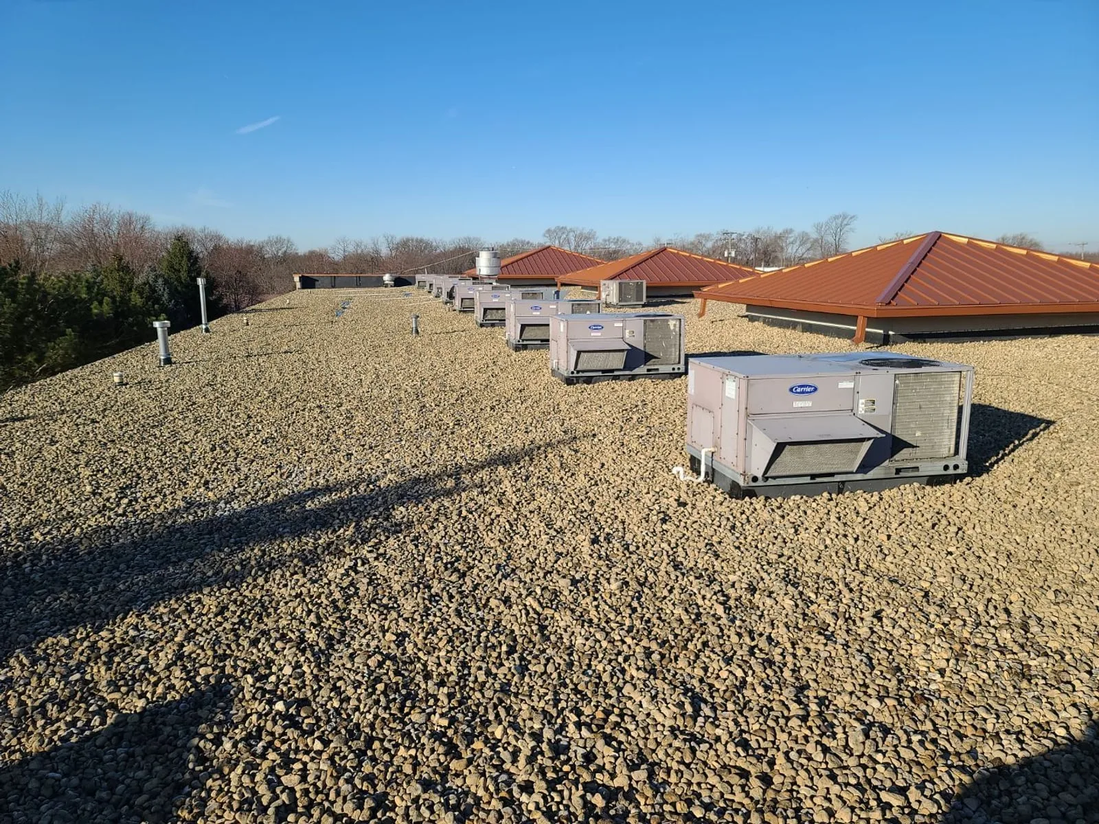 Completed commercial EPDM recover with new HVAC units by Americanstruction