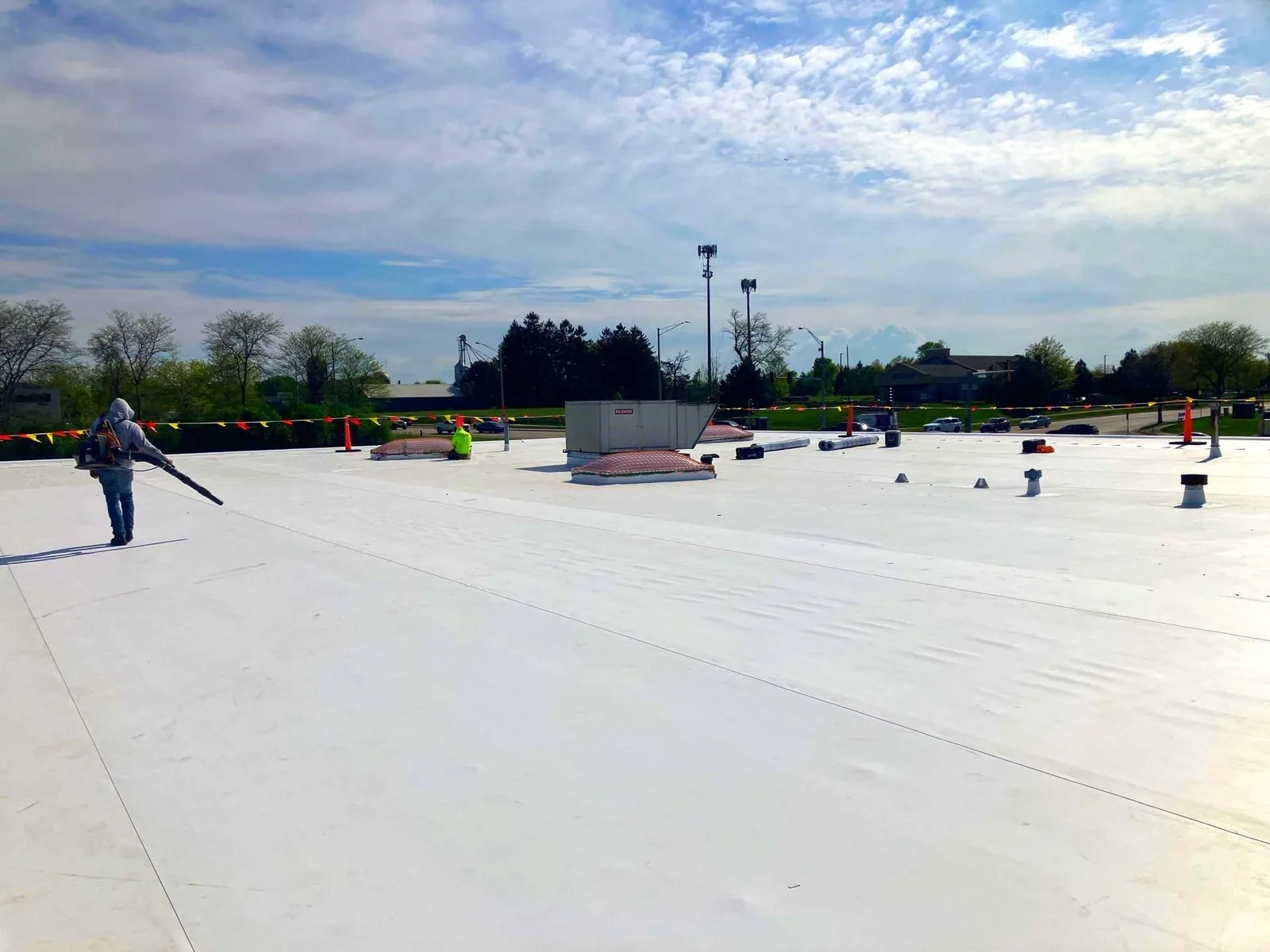 Americanstruction crew on a completed commercial TPO recover