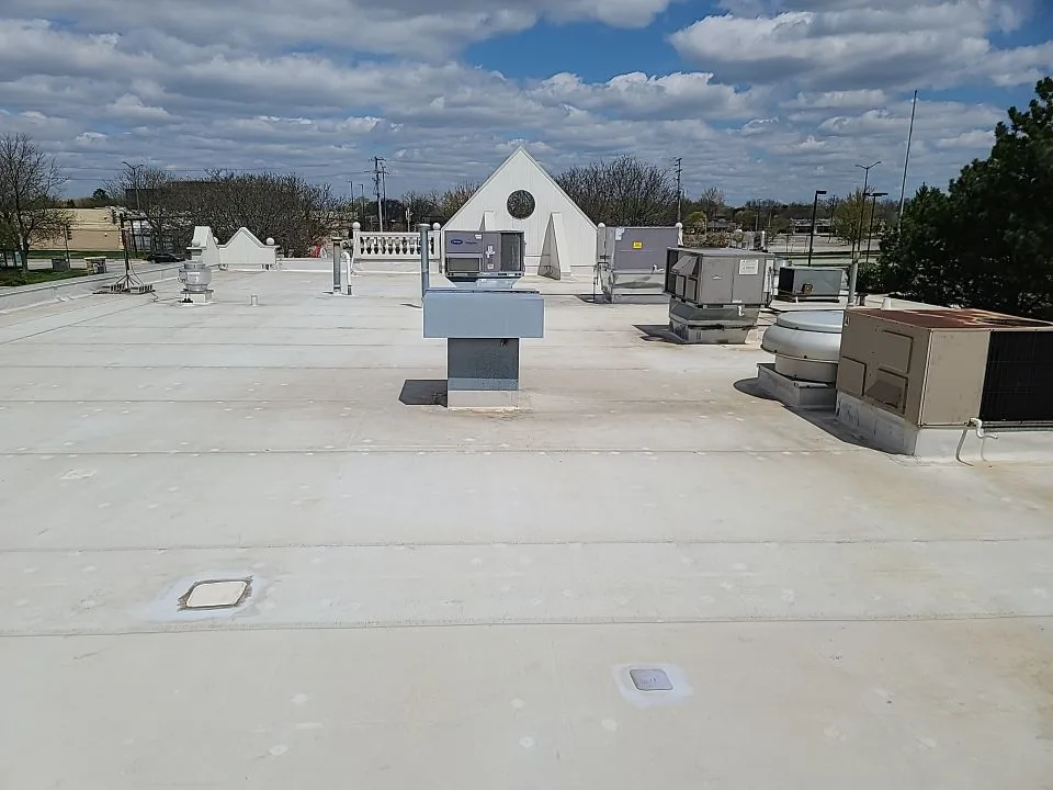 Failed roof system on Aurora Galena Boulevard retail center before tear-off