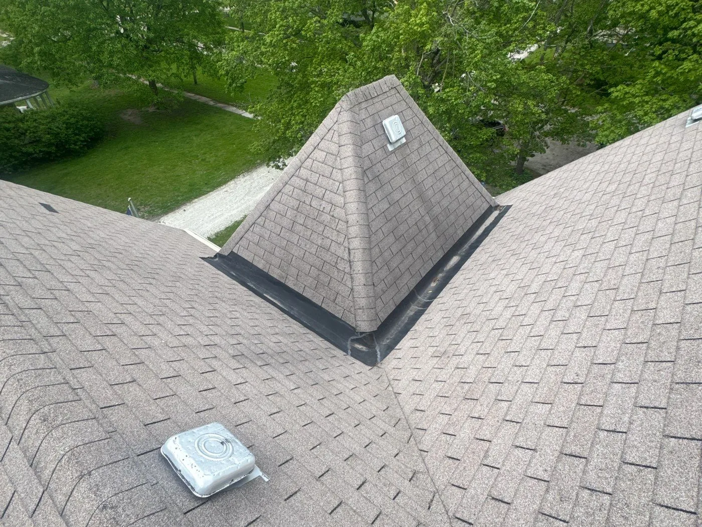 The Powell's Bonfield roof with worn shingles before the storm restoration