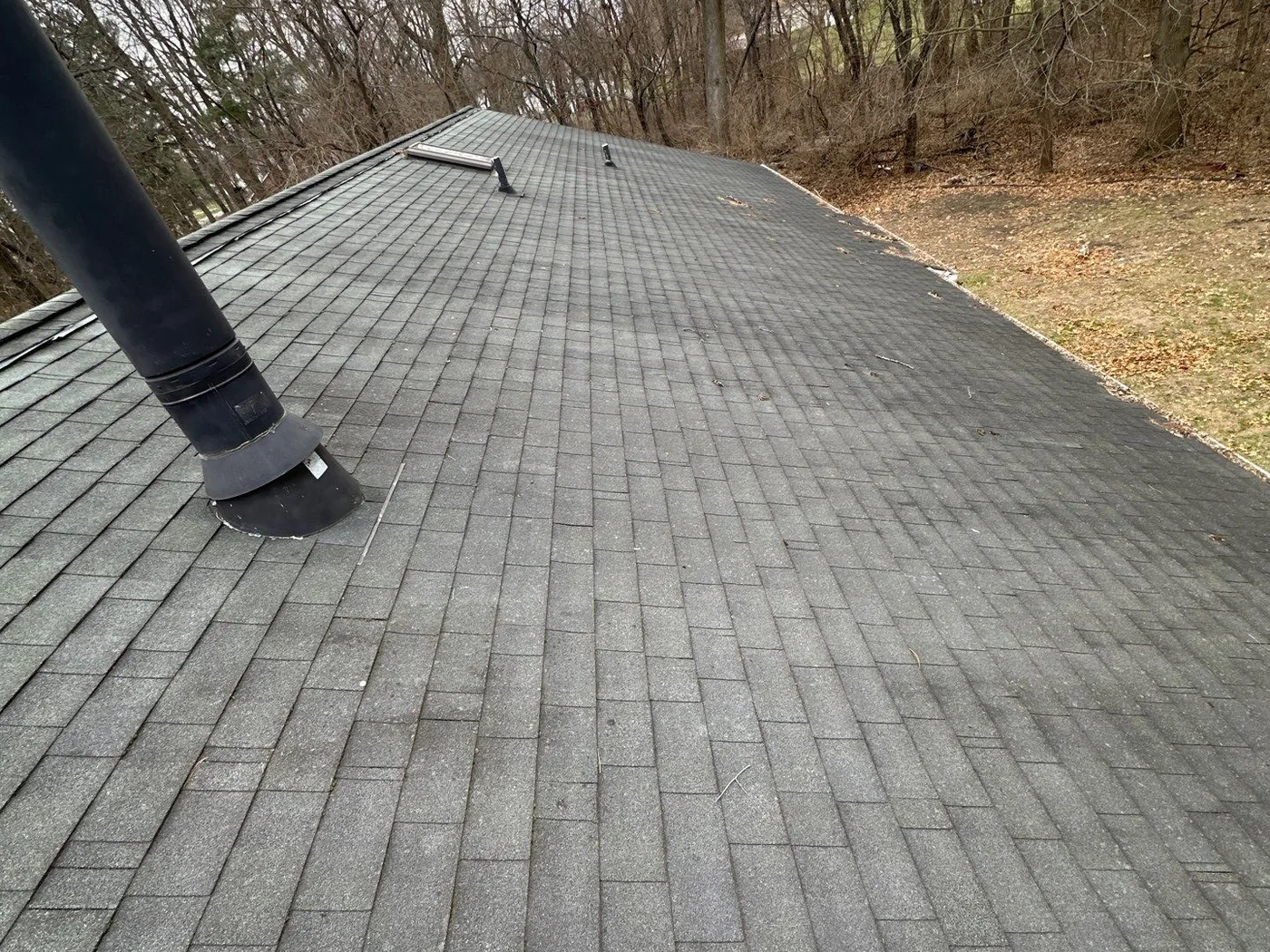 The Vanvoorst's Bonfield roof with aging shingles before the storm restoration