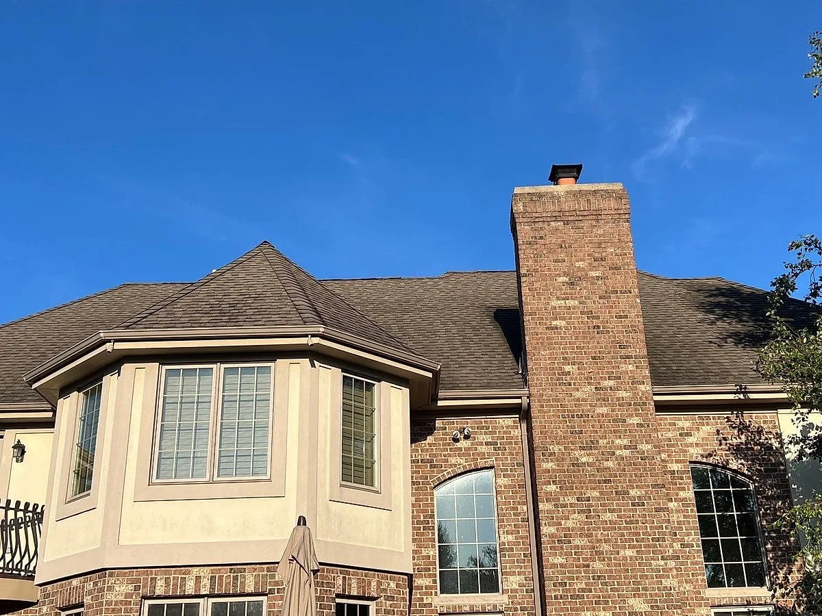 Motto Homer Glen home rear elevation before roof, gutter, and downspout replacement