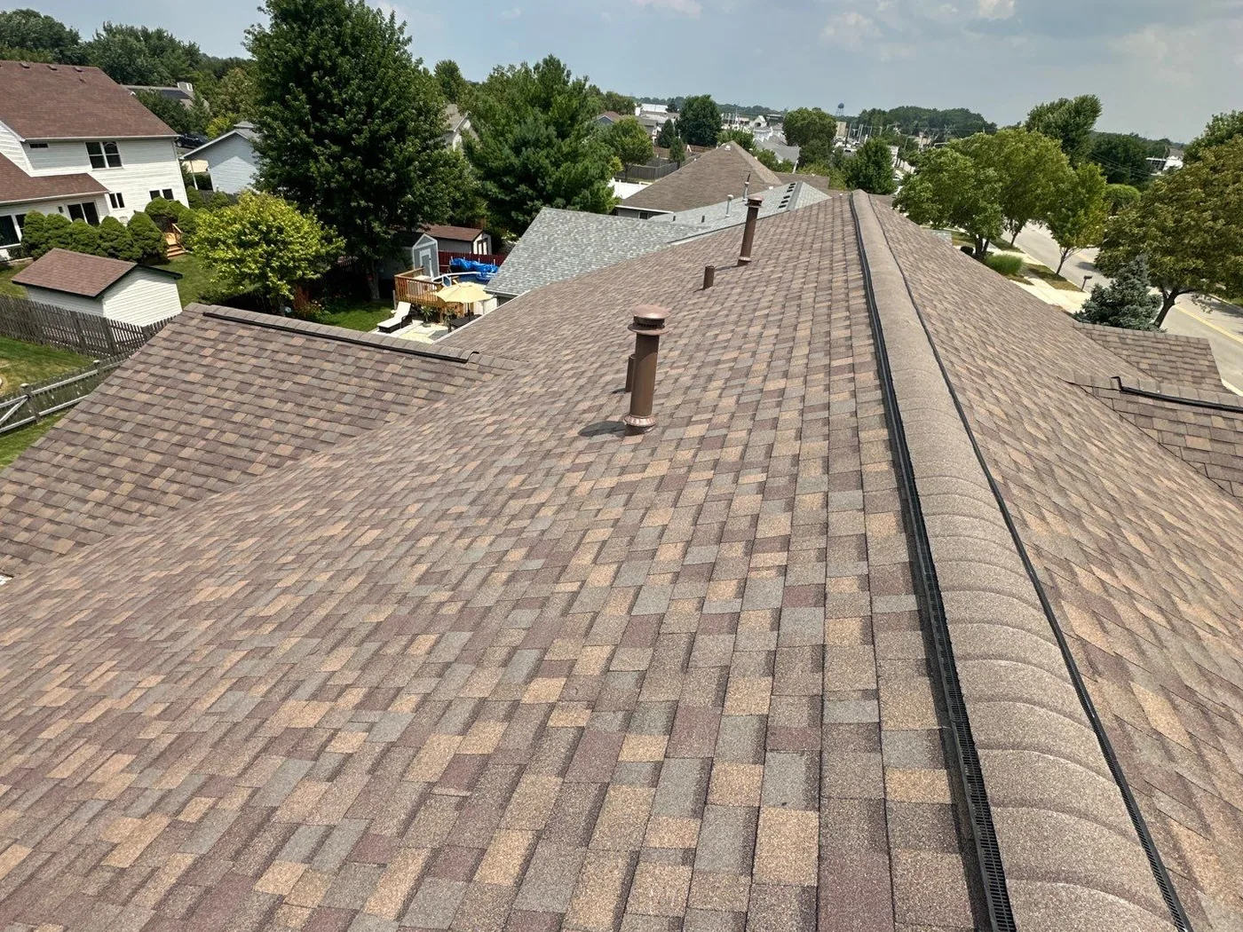 The Nicholson's Joliet duplex with a new Owens Corning architectural shingle roof and continuous ridge vent