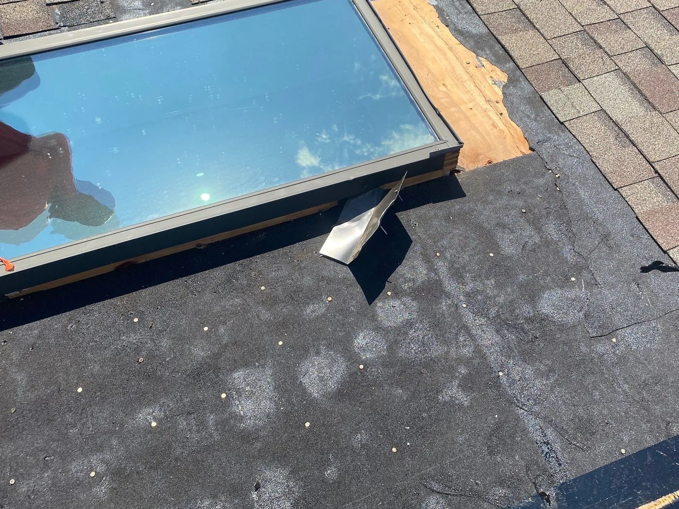 The Bahnaman's aging skylight and torn-off roof section in Mokena before the replacement