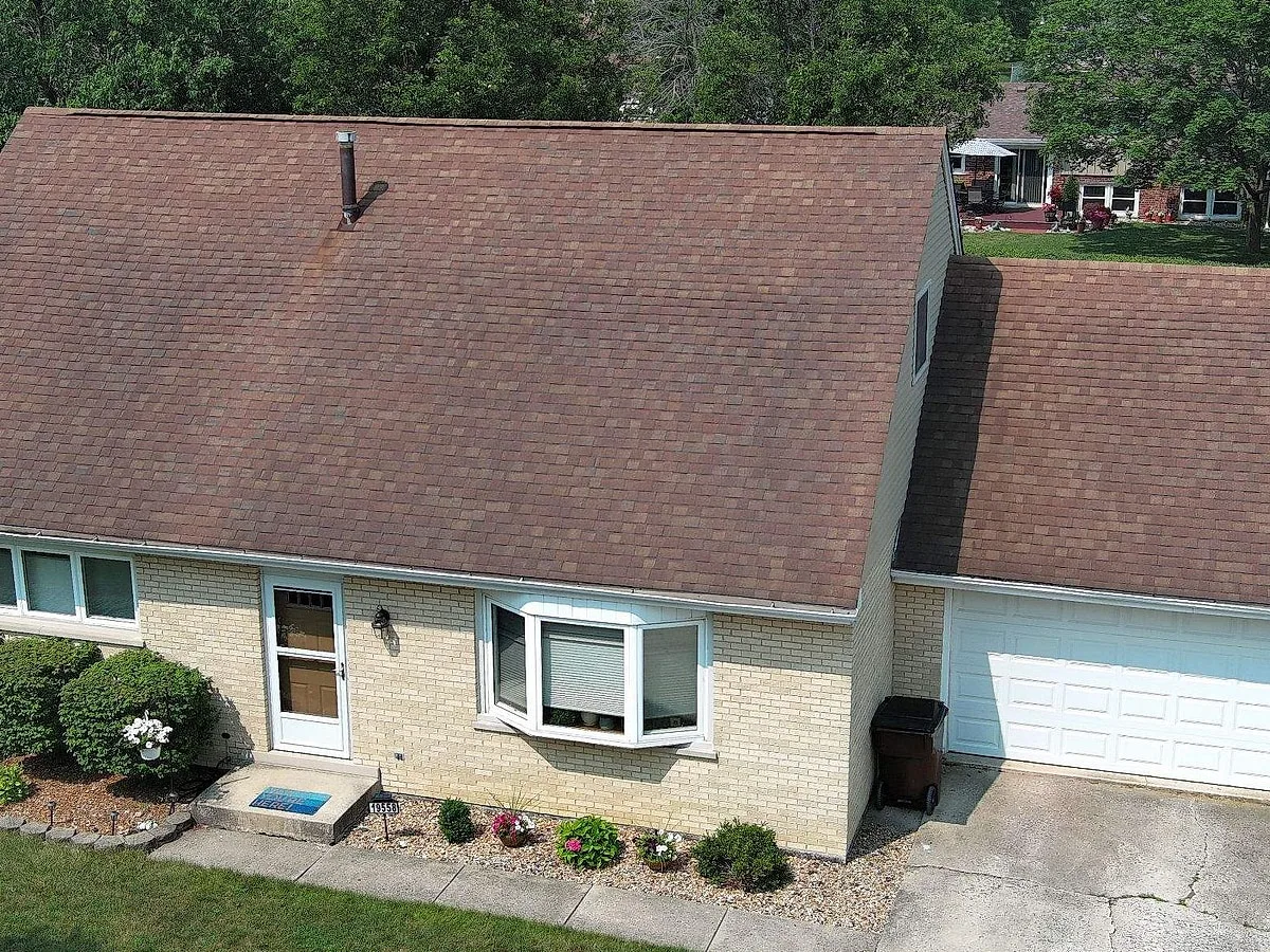 Mansmith Mokena home with aging shingle roof showing granule loss before replacement