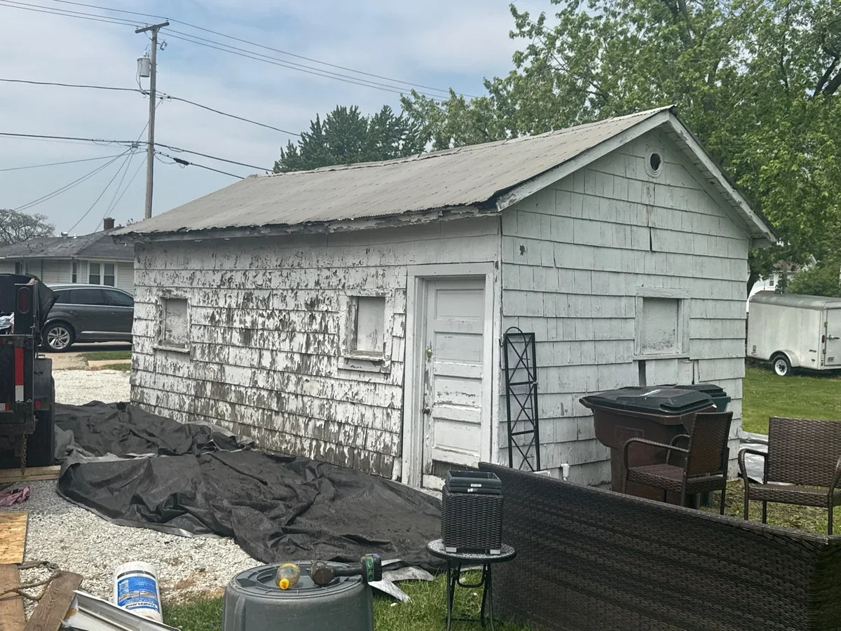 The Shea's Mokena property with failing asbestos-shingle siding and an aged roof before the project