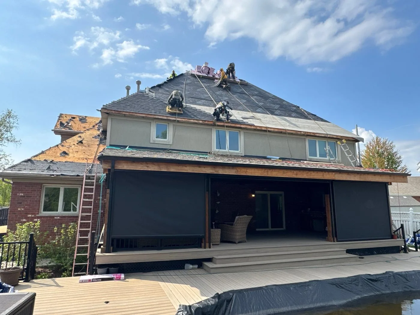 Installation in progress on two-story home