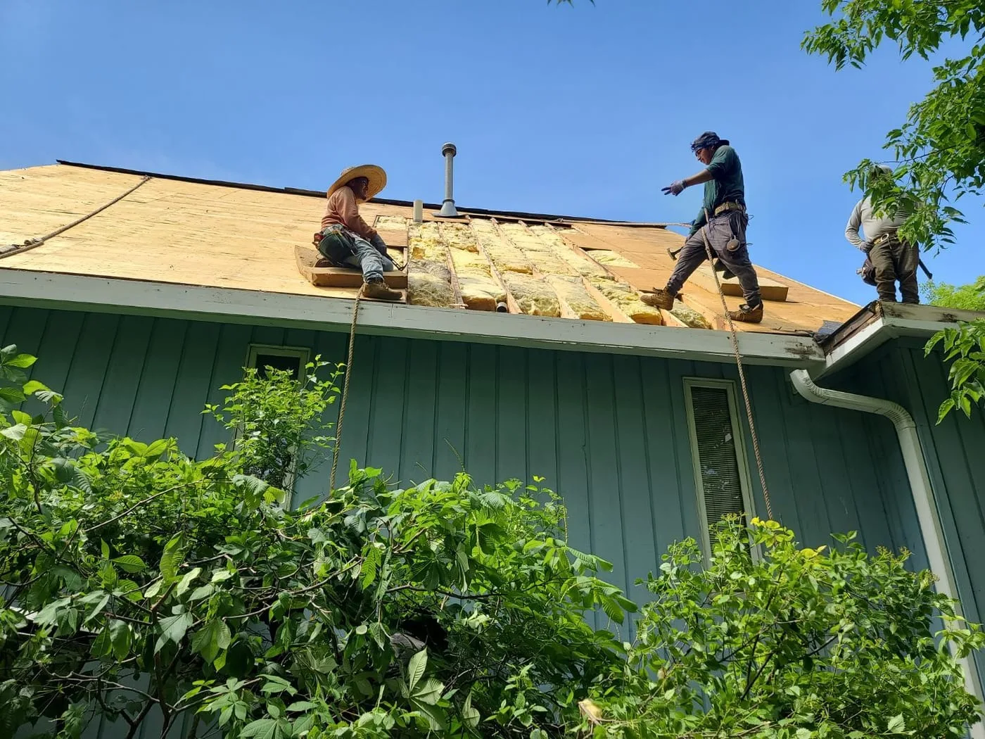 Americanstruction crew performing residential roof tear-off in the Chicago suburbs