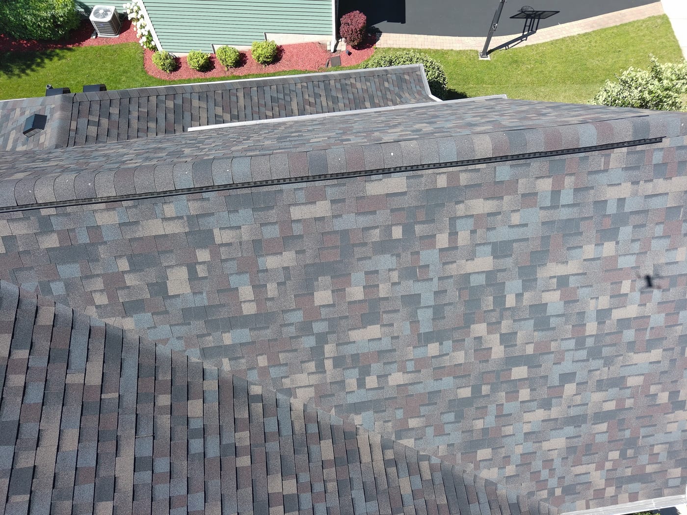 Close-up of hail damage on a New Lenox roof documented by Americanstruction