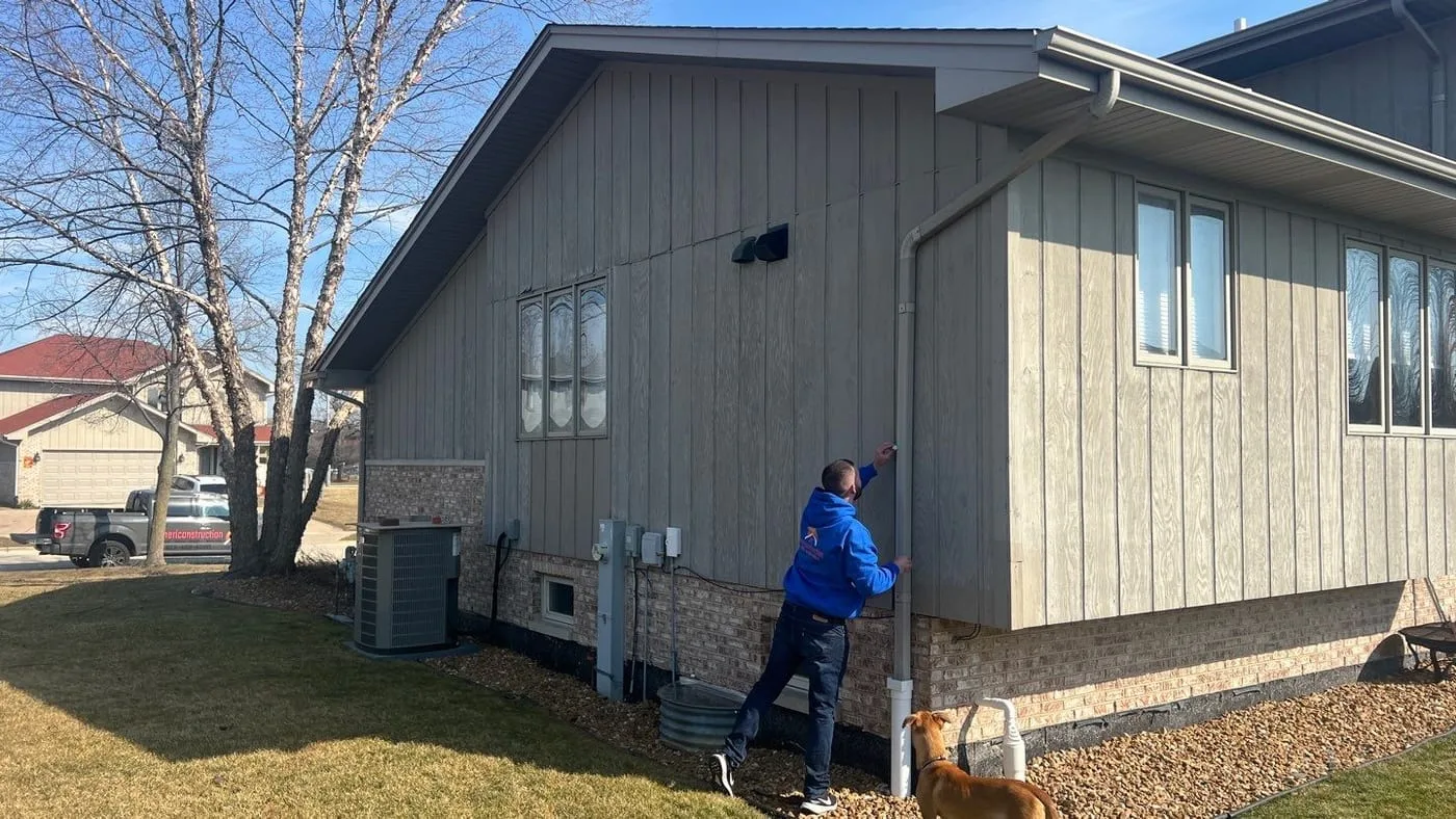 Americanstruction inspector documenting exterior