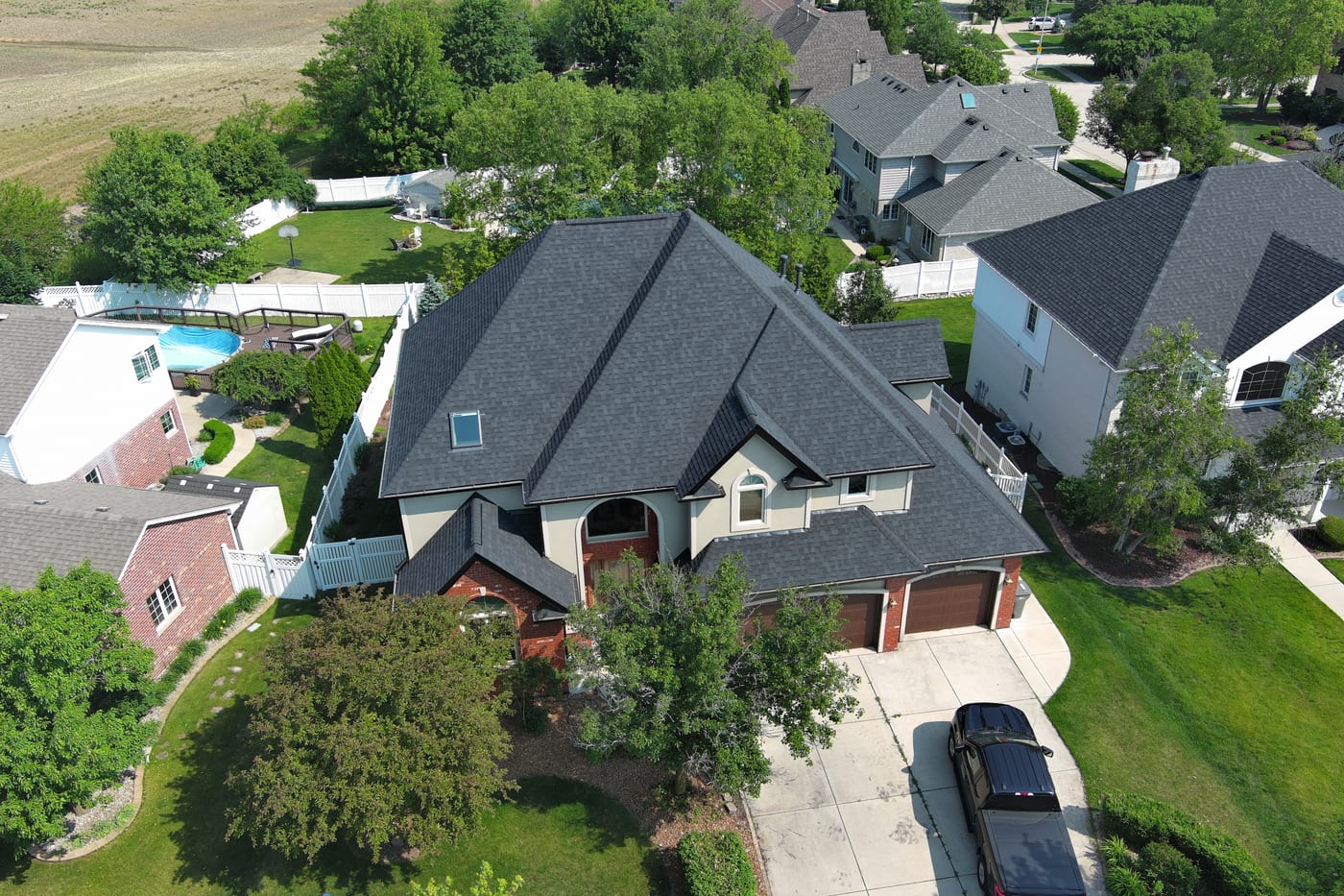 Completed asphalt shingle roof on Orland Park home, aerial drone view