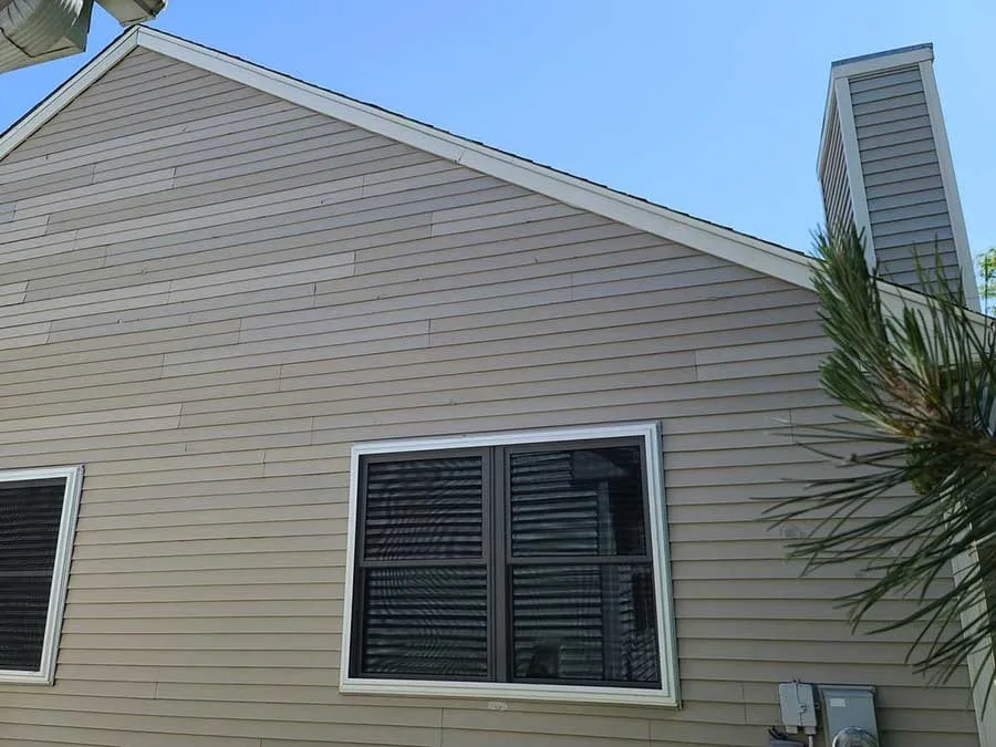 Specialty-shape window on gable of residential home